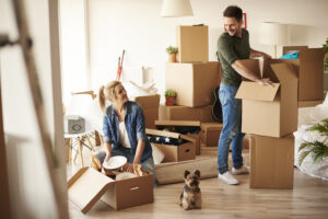young-couple-new-apartment-with-small-dog-scaled.jpg